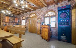 a dining room with a dart board on the wall at Gorgeous Home In Rovisce in Rovišće