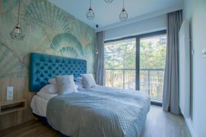 Voodi või voodid majutusasutuse Baltic Seasons by Alluxe Boutique Apartments toas