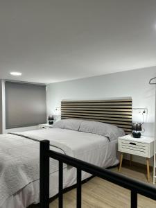 Llit o llits en una habitació de Apartamento La Gloria 1
