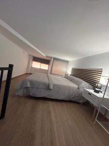 Llit o llits en una habitació de Apartamento La Gloria 1