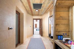 a hallway in a house with a wooden ceiling at Breeze Of Cappadocia in Nevsehir