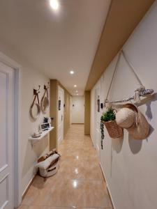 a hallway of a home with a toilet and baskets at Pensión Cabezas in Lugones