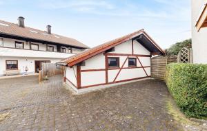 a white and brown house with a brick driveway at Stunning Apartment In Wald With House A Panoramic View in Wald