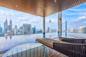 a swimming pool with a view of the city at CL24A 5-6pax KLCC Sky Pool Condo in Kuala Lumpur