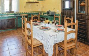 a kitchen with a table with dishes on it at Nice Home In Hornachuelos With Wifi in Hornachuelos