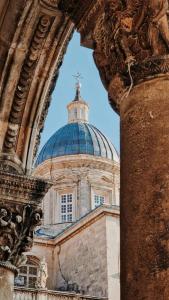 a building with a blue dome on top of it at The Saint Blaise Old Town Swanky Heritage in Dubrovnik