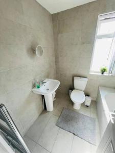 a bathroom with a toilet and a sink at Suite 3 - Classic Private Room near City Centre in Liverpool
