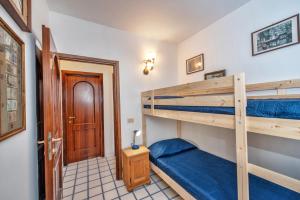 a room with two bunk beds and a door at Casa Rosamare in Praiano