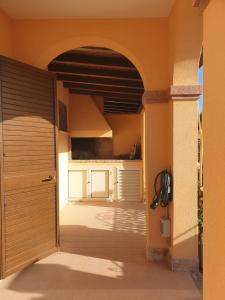 an entrance to a house with an open door at Lito’s house in Villasimius in Villasimius
