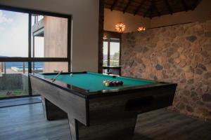 a billiard room with a pool table in a house at Shammah lodge Mabalingwe Nature Reserve in Mabula
