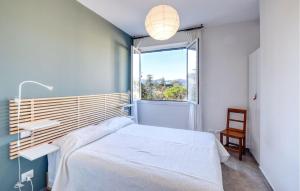 a bedroom with a bed and a window at Nice Apartment In Zoagli With Kitchen in Zoagli