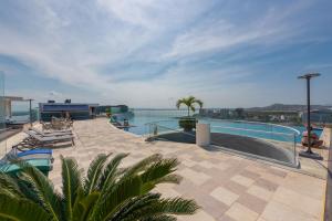 a swimming pool on the roof of a building at Apartment With natural view in Cartagena de Indias