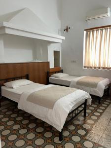 A bed or beds in a room at Held Hotel
