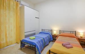 Voodi või voodid majutusasutuse 2 Bedroom Nice Apartment In Pozzallo toas