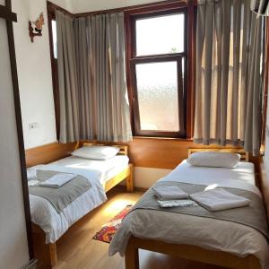 A bed or beds in a room at Held Hotel