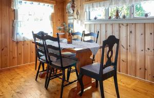 a dining room with a table and chairs at 2 Bedroom Cozy Home In Skodje in Skodje