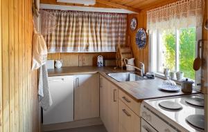 a small kitchen with a sink and a window at 2 Bedroom Cozy Home In Skodje in Skodje