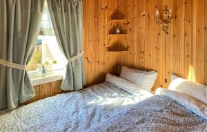 a bedroom with a bed and a window at 2 Bedroom Cozy Home In Skodje in Skodje