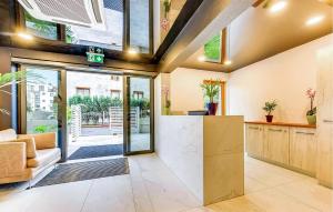 an open living room with a large glass door at Lovely Apartment In Hel With Kitchen in Hel