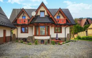 a large house with a gambrel roof at Gorgeous Home In Poronin With Wi-fi in Poronin