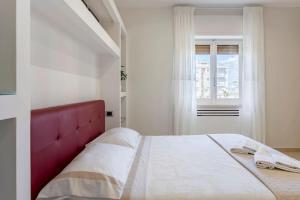 A bed or beds in a room at Appartamento Le Zagare