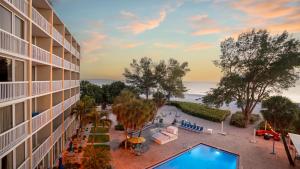 an aerial view of a hotel with a swimming pool at RumFish Beach Resort by TradeWinds in St Pete Beach