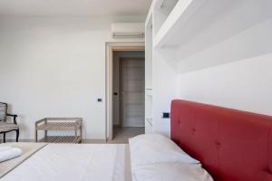 A bed or beds in a room at Appartamento Le Zagare