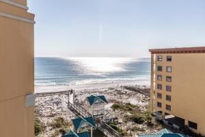 a view of the beach from the balcony of a building at Azure in Fort Walton Beach