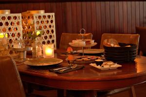a table with plates of food on top of it at Het Wapen van Noordwijkerhout in Noordwijkerhout