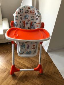 an orange and white high chair with a seat at Amazing 3BDR Apt with Unique Roof Garden in Plaka in Athens