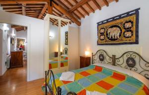a bedroom with a colorful bed in a room at Gorgeous Apartment In Gubbio With Wifi in Gubbio