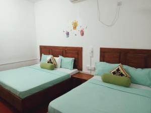 Voodi või voodid majutusasutuse White Villa Hotel toas