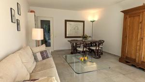 a living room with a couch and a table at Ascona Bellavista in Ascona