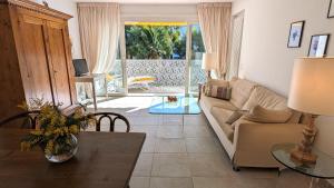 a living room with a couch and a table at Ascona Bellavista in Ascona