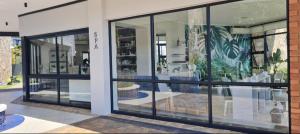 a store with large glass windows in a building at Ballito Hills Lifestyle Estate in Ballito