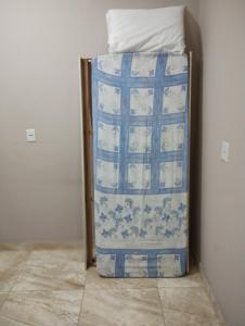 a blue and white refrigerator sitting in a room at Pico do Jaraguá in São Paulo +1 photo