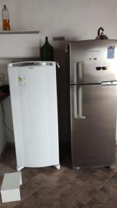 a refrigerator and a freezer in a kitchen at Pico do Jaraguá in São Paulo