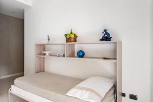 A bed or beds in a room at Appartamento Le Zagare