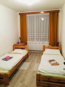 A bed or beds in a room at Rodinný RETRO domček