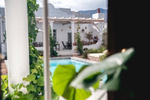 a view of a swimming pool from a house at The Grand Hotel Robertson in Robertson