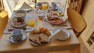a table with breakfast foods and drinks on it at Hillhead House in Ardara
