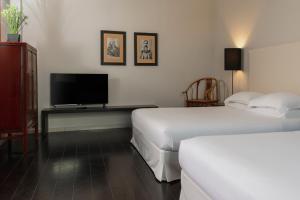 Кровать или кровати в номере Hotel Carducci 76