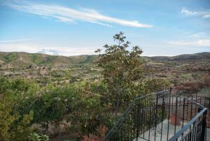 a balcony with a view of a valley at Gaia garden house in Gáïa