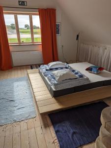 Postel nebo postele na pokoji v ubytování GAMLA LADEN