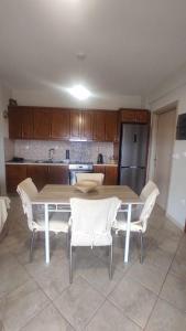 a kitchen with a table and chairs in a kitchen at AGNANTIO HOME in Monemvasia +12 photos