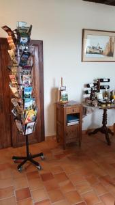 a room with a book shelf with books and a desk at Bellopratainnes in Bazouges-sur-le-Loir