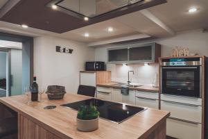 a kitchen with a counter with a sink in it at Ferienwohnung Tretter Natur Pur in Erbendorf