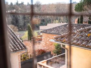 a view from a window of a roof at Les Ateliers de Philadelphe in Gaillac
