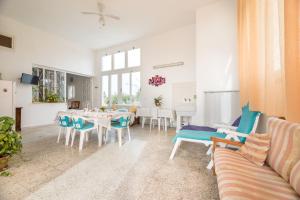 a living room with a table and chairs at La Dimora Lucia by Paf in tour in Torre Suda