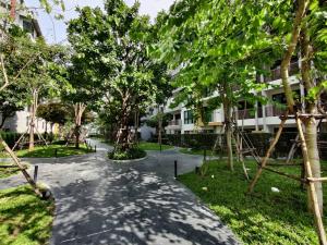 a walkway in front of a building with trees at modern 2 bedrooms,Ayuttaya in Ban Ko Rian